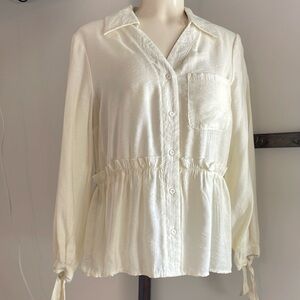 Cleo Creamy Dressy button down shirt with wrist ties.
